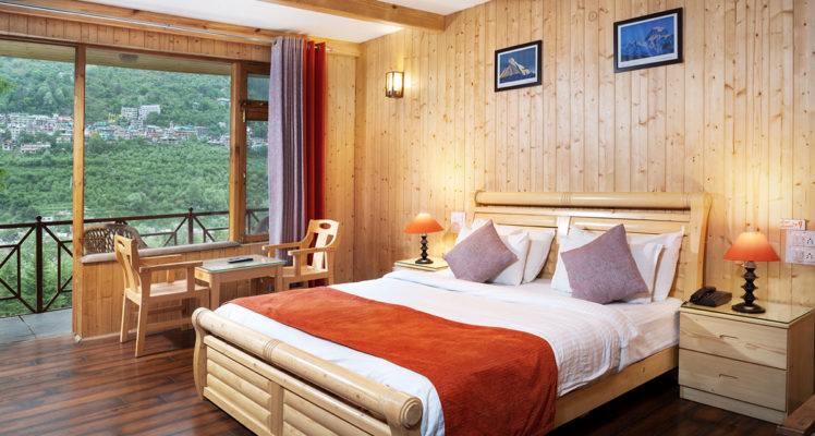 luxury-cottage-room-shobla-pine-royale-bed-seating-area-view